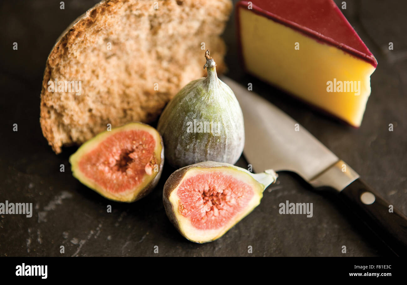 Figs, cheese and bread with cheese knife Stock Photo