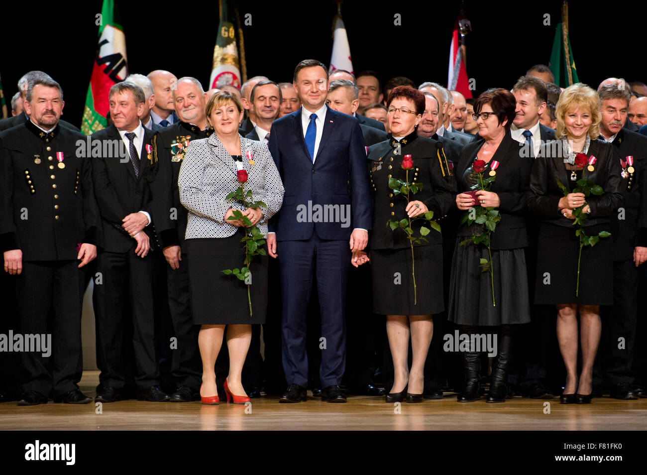 Belchatow, Poland. 4th December, 2015. President of Poland, Andrzej Duda, poses for picture with Polish miners, during 'Barbórka' - the annual Miners' Day. Credit:  Marcin Rozpedowski/Alamy Live News Stock Photo
