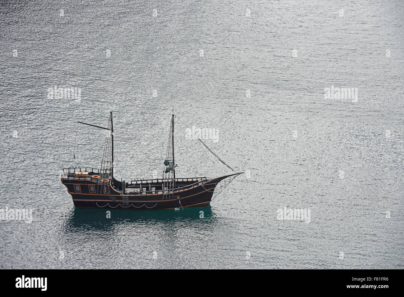 High angle view of yacht on rippled surface of sea water background ...