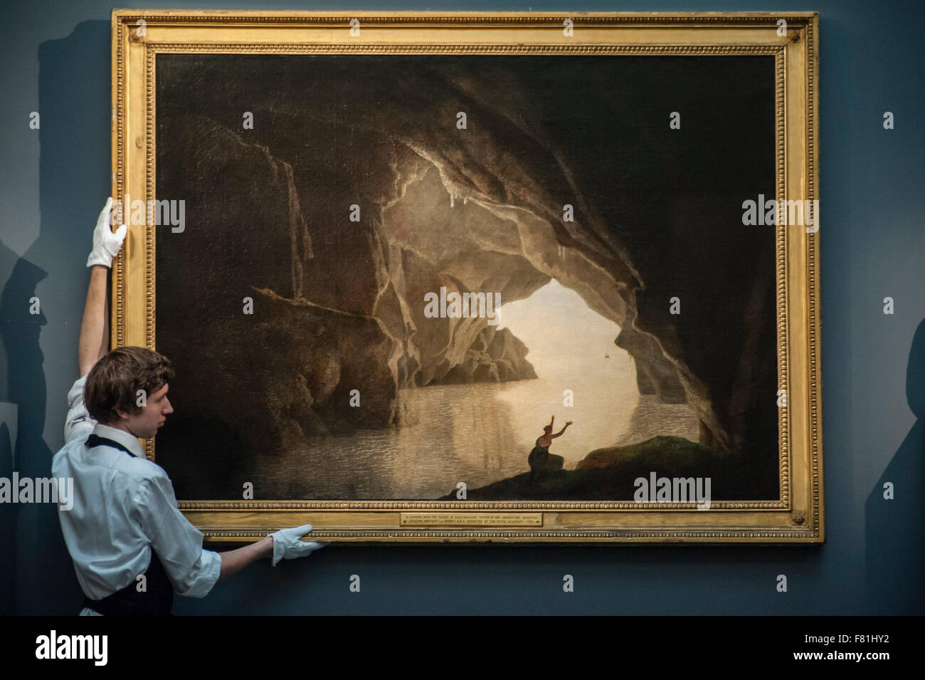 London, UK. 4 December 2015. A technician presents 'A grotto in the Gulf of Salerno, with the figure of Julia, banished from Rome' by Joseph Wright of Derby (est. £100,000-150,000), ahead of Sotheby's London evening sale of Old Master and British paintings on 9th December 2015.  Credit:  Stephen Chung/Alamy Live News Stock Photo