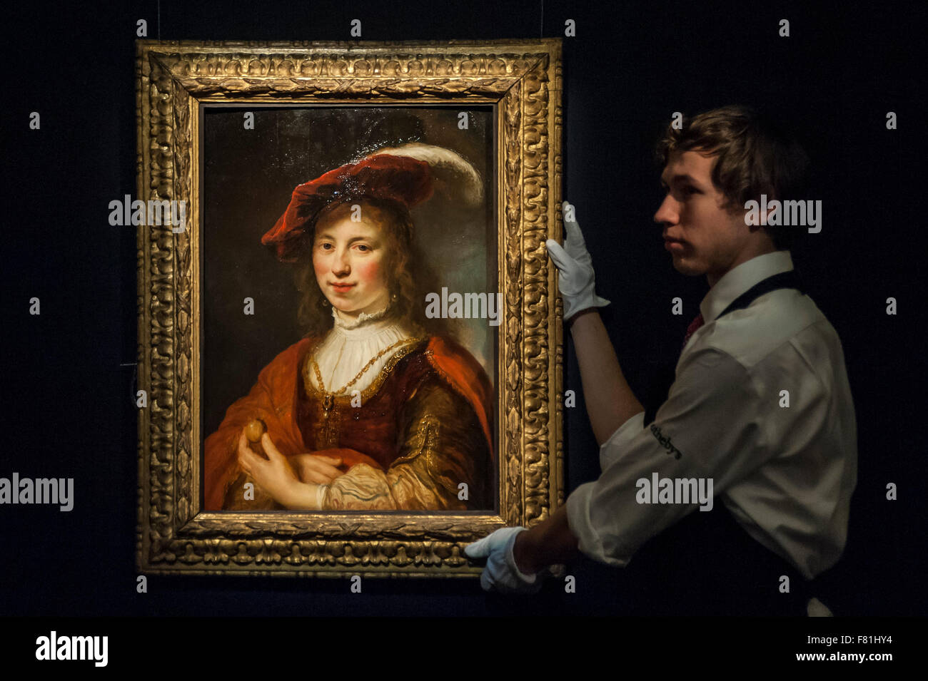 London, UK. 4 December 2015. A technician presents 'A tronie of a young woman' by Govert Flinck (est. £0.2-0.3 million) ahead of Sotheby's London evening sale of Old Master and British paintings on 9th December 2015. Credit:  Stephen Chung/Alamy Live News Stock Photo