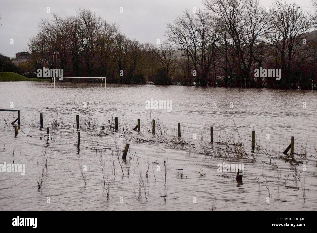 South Wales, UK. 4th December 2015.  Prolonged rain falling on saturated land has left low lying agricultural areas flooded. The river Towy bursts its banks flooding surrounding farmland near Carmarthen, south Wales, UK. A local playing field near Abergwili is submerged. Credit:  Algis Motuza/Alamy Live News Stock Photo