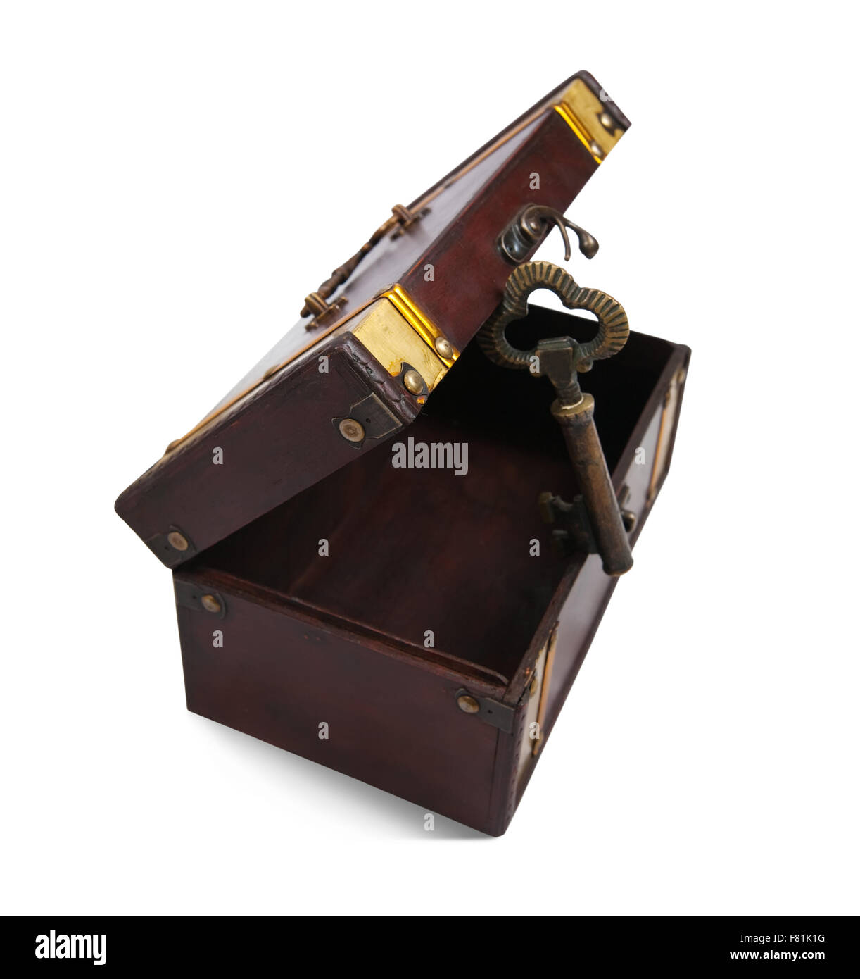 Gold key on opened treasure chest , isolated with clipping path over ...