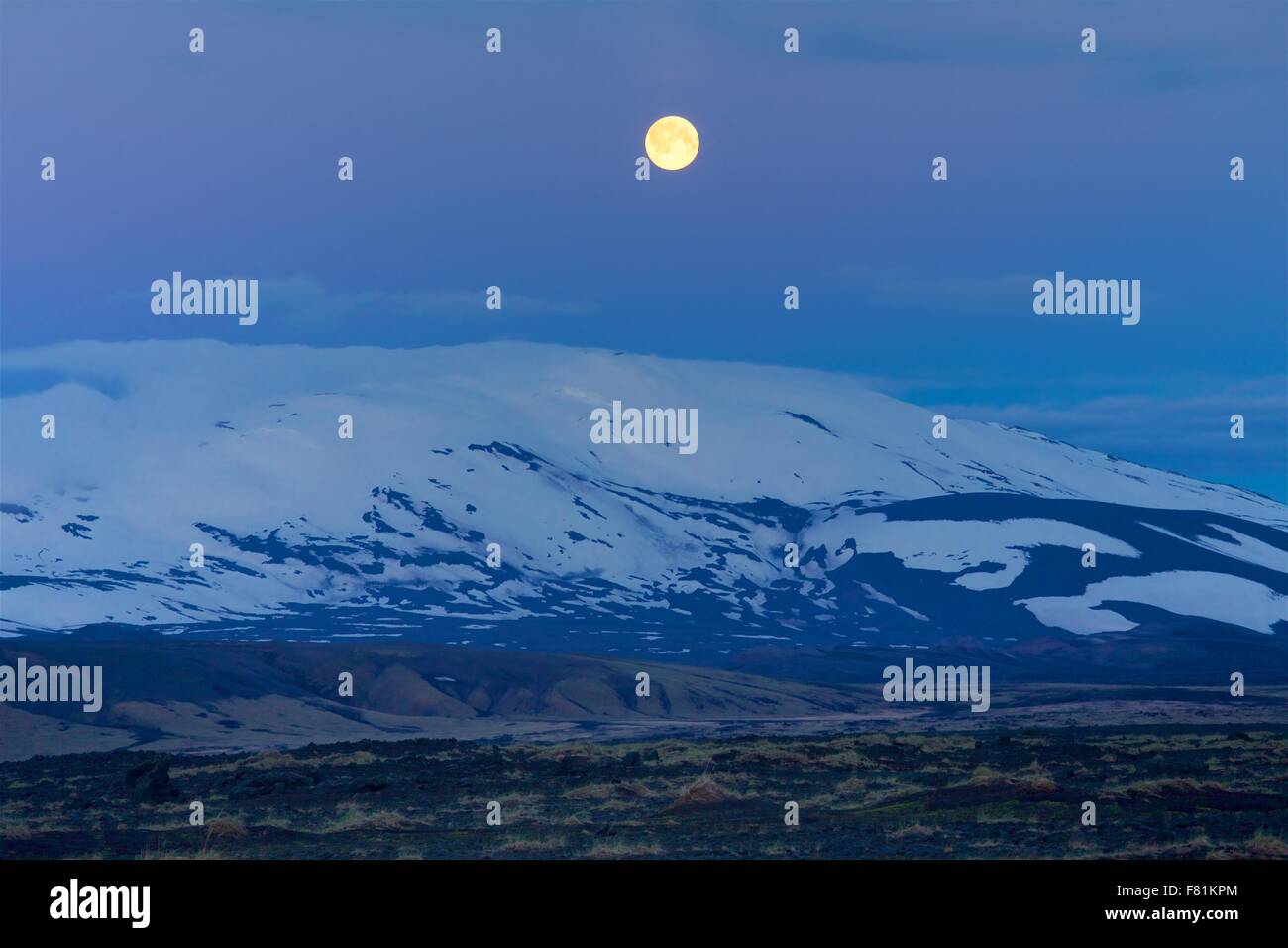 Full moon over Mount Hekla, an active volcano in Iceland Stock Photo