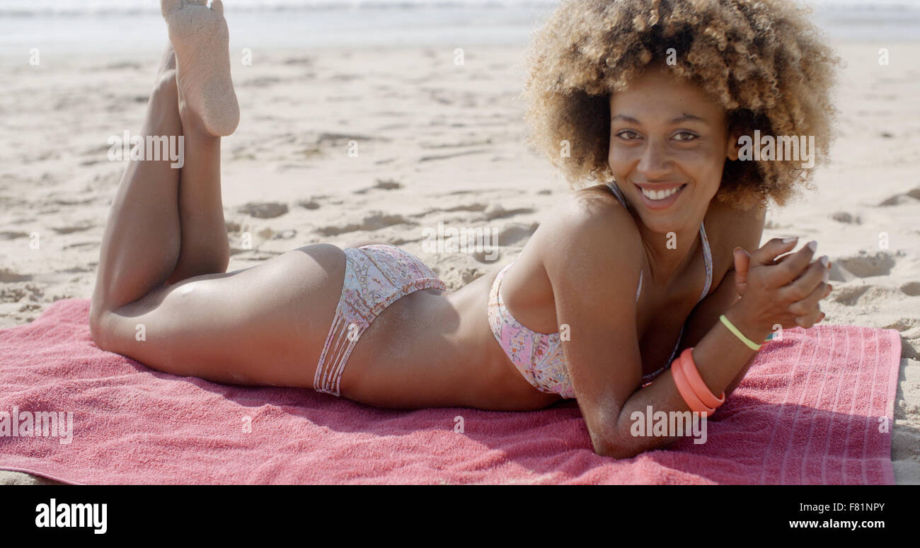 Girl In Bikini Lying At Beach Stock Photo - Alamy