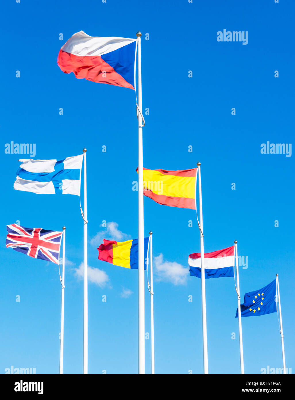 Flags of the EU countries flying against a blue sky Stock Photo