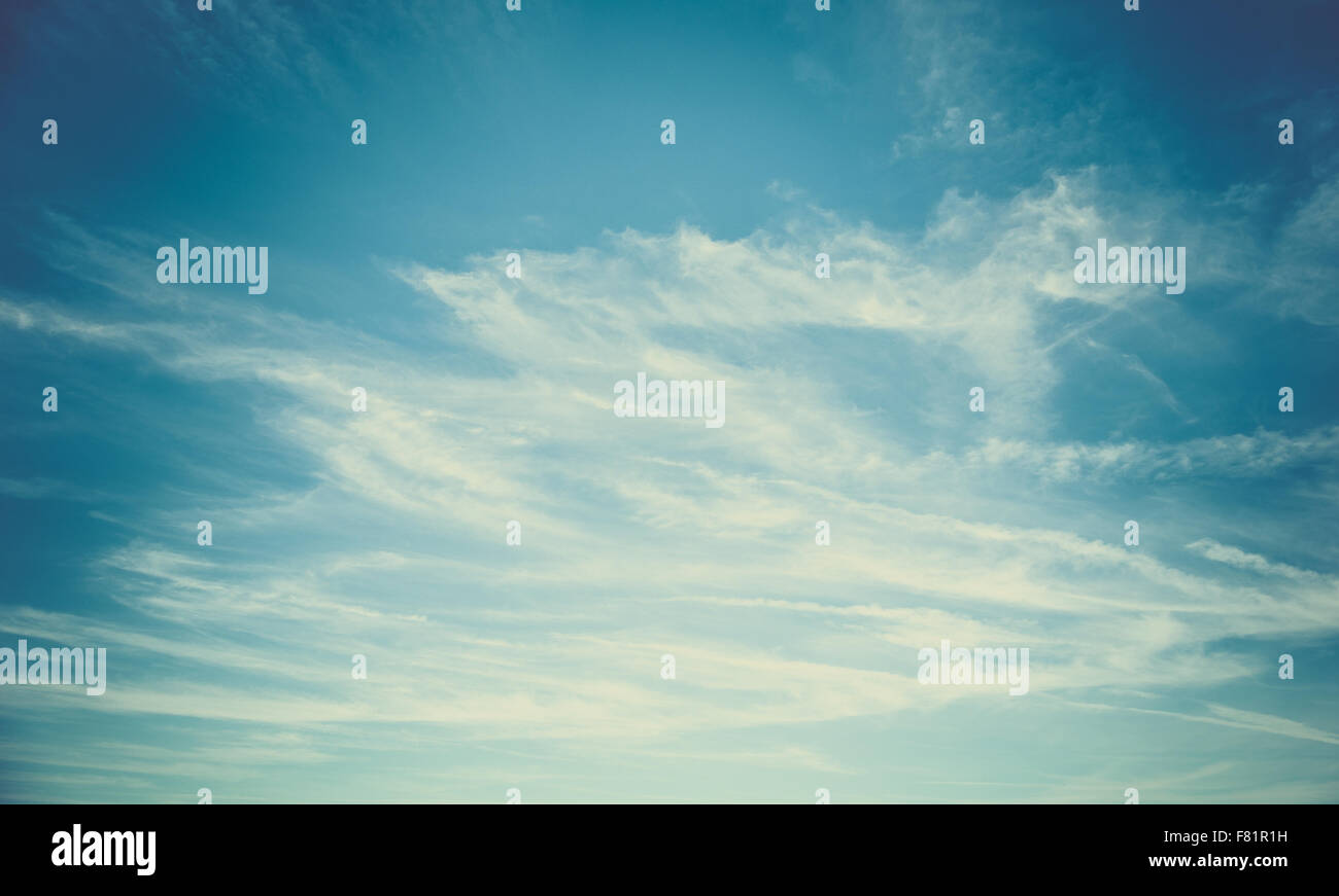 Blue sky and white fluffy clouds background Stock Photo