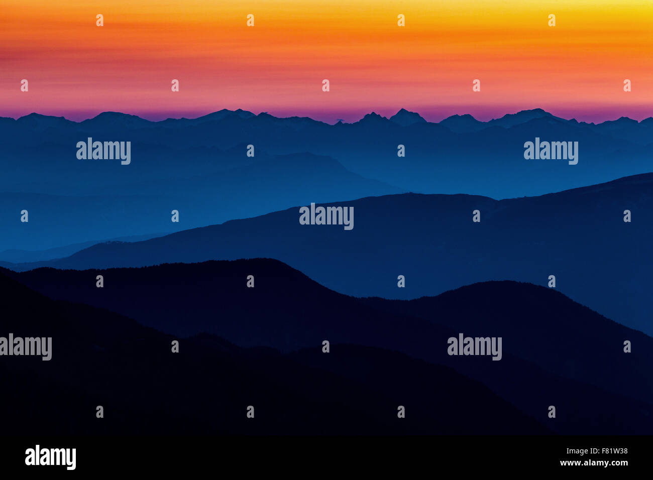Mountain profiles / layers at sunset. Sky colors. Trentino-Alto Adige peaks. Italian Alps. Europe. Stock Photo