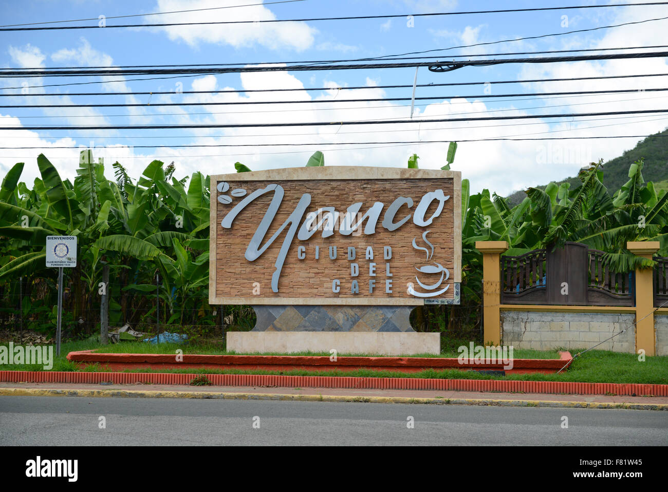 Sign at the entrance of the town of Yauco, Puerto Rico. USA territory. Caribbean Island. (Banana plantation in the background) Stock Photo