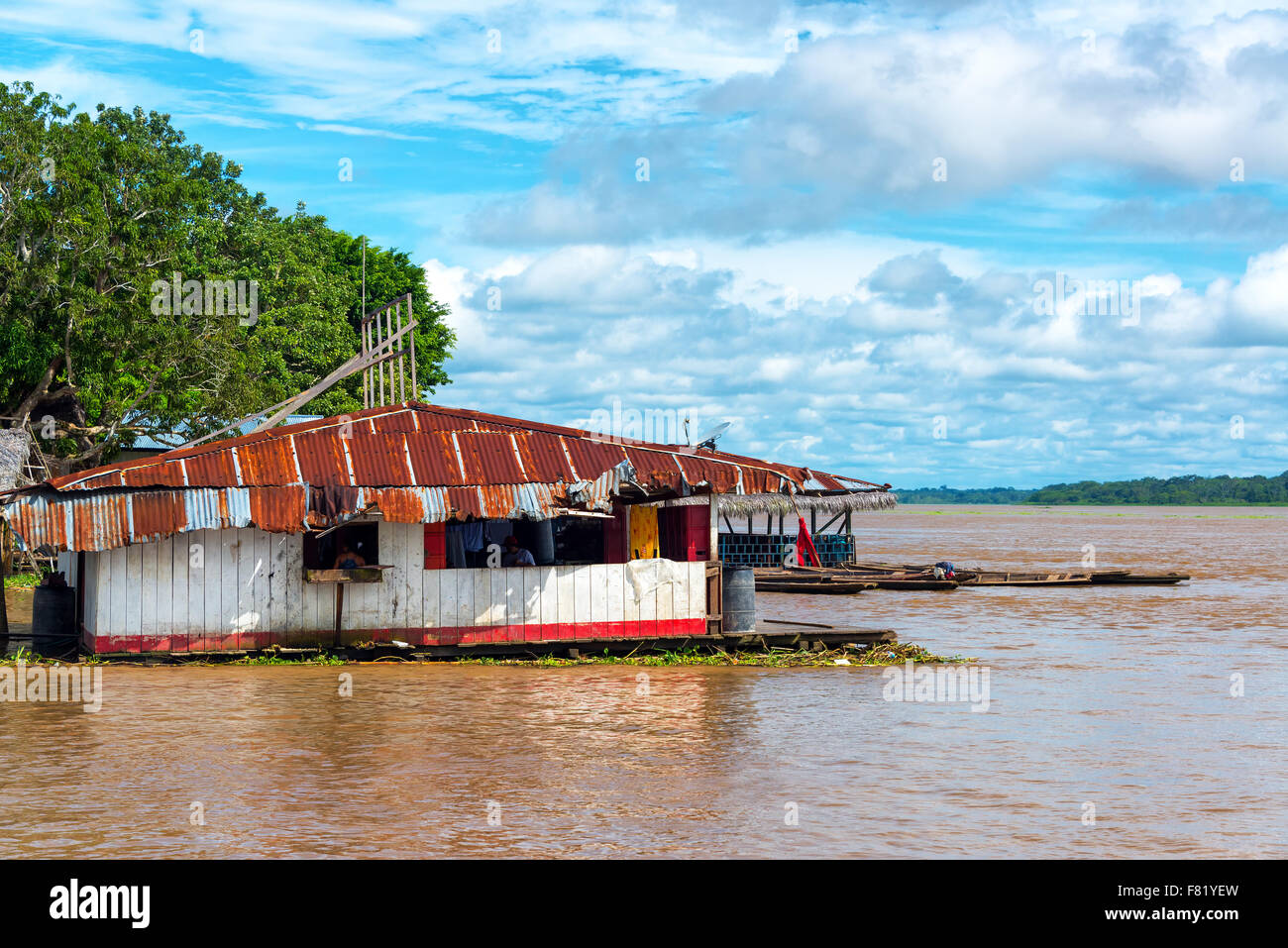 Floating shack on the Amazon River in the town of Tamshiyacu, Peru Stock Photo