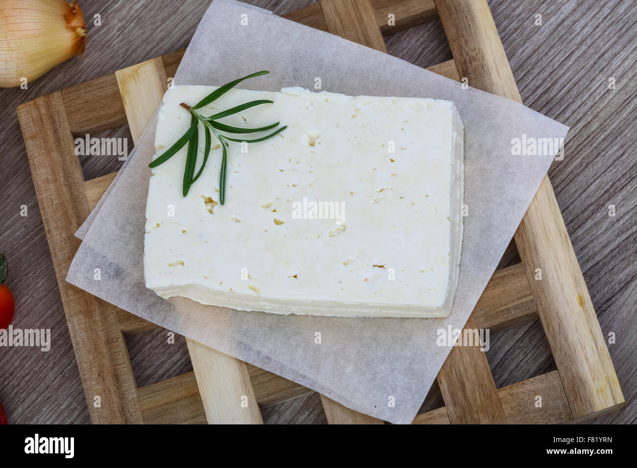 Traditional Caucasian homemade Cheese Brinza with rosemary on wood background Stock Photo