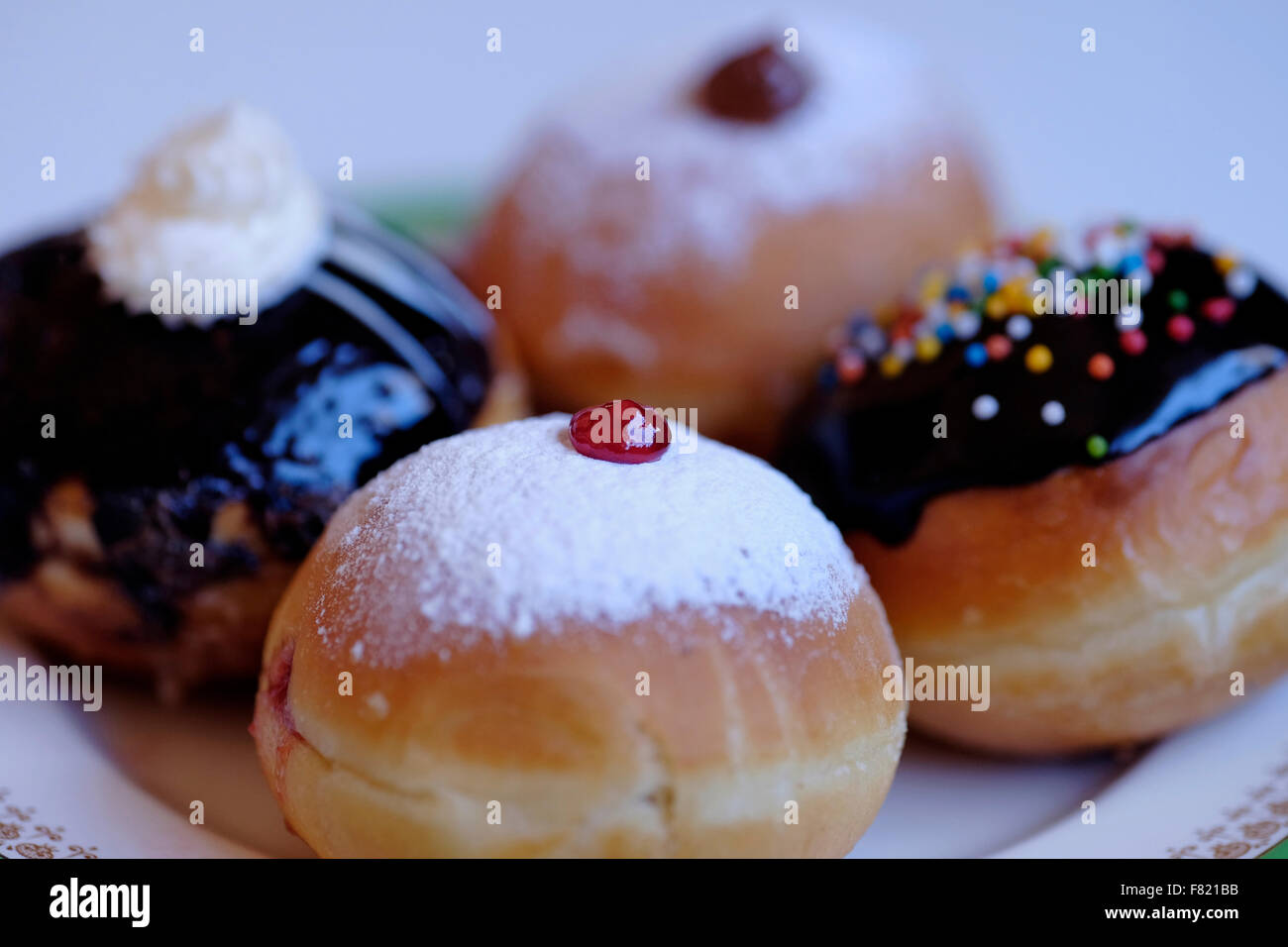 Elegantly traditional Sufganiyot deep fried round doughnut eaten during