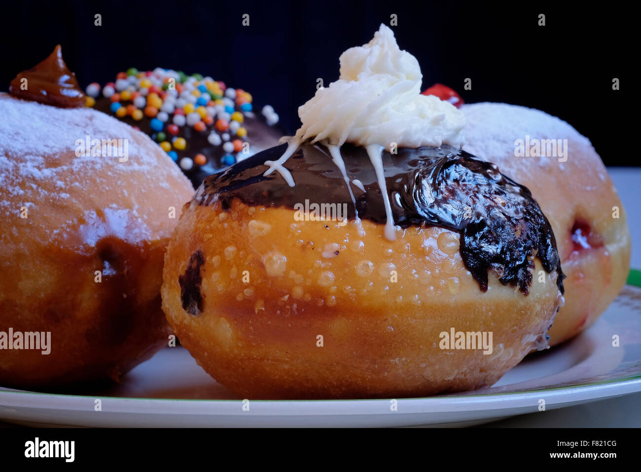 Elegantly traditional Sufganiyot deep fried round doughnut eaten during