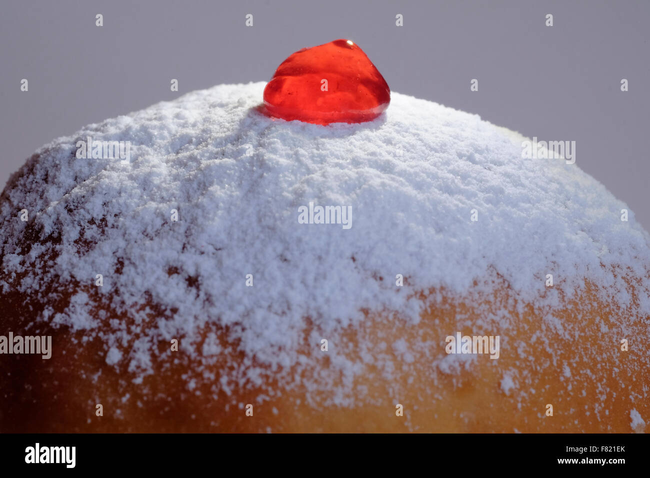 Traditional Sufganiya deepfried round doughnut topped with powdered