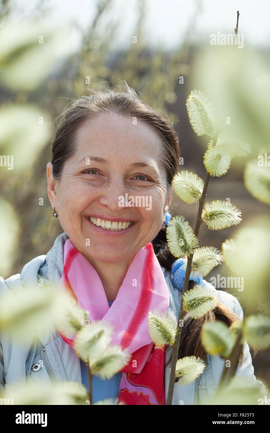 portrait of mature woman in spring willow plant Stock Photo - Alamy