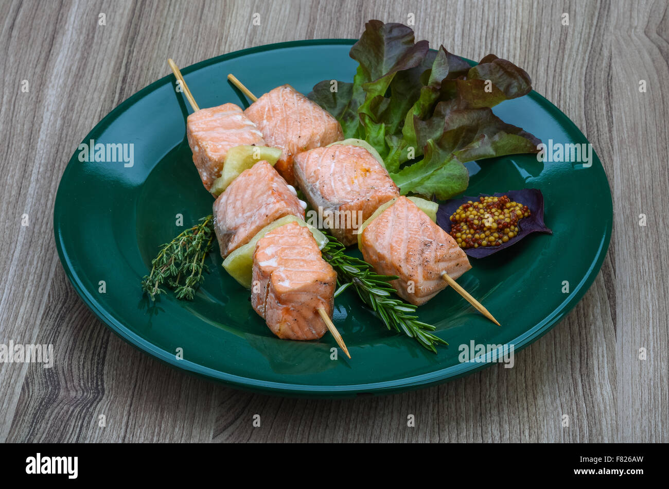 Salmon skewers with rosemary, salad, pepper and spices Stock Photo Alamy