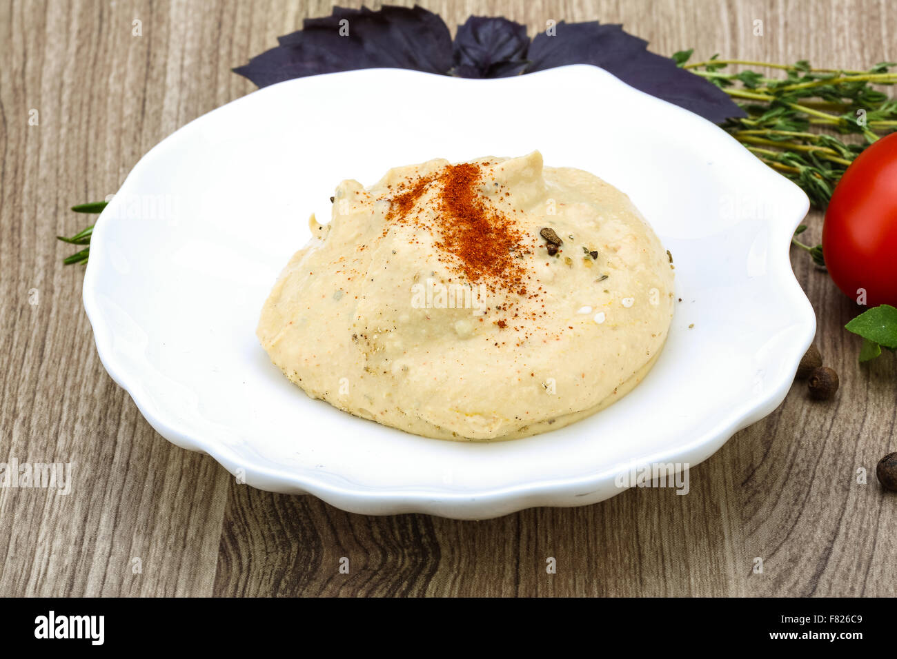 Arabic traditional cusine - hummus with olive oil, herbs and spices ...
