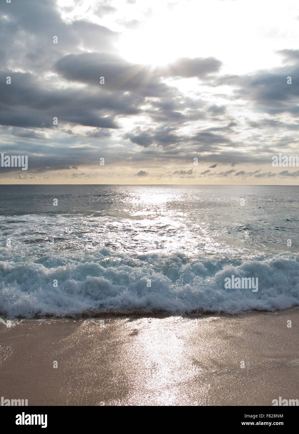 Surf at sunset Stock Photo