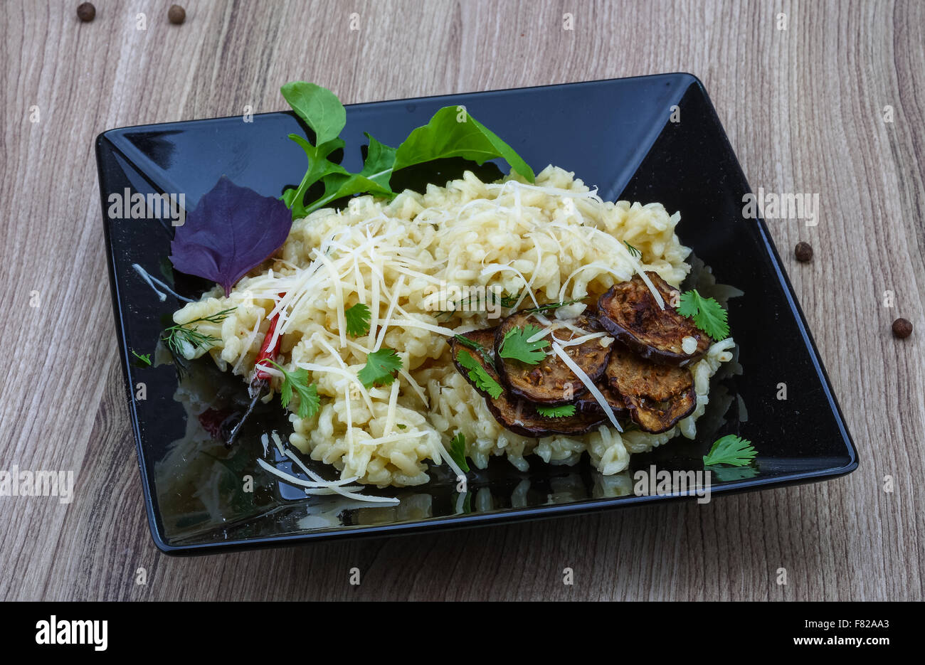 Italian trditional Risotto with eggplant and coriander Stock Photo Alamy
