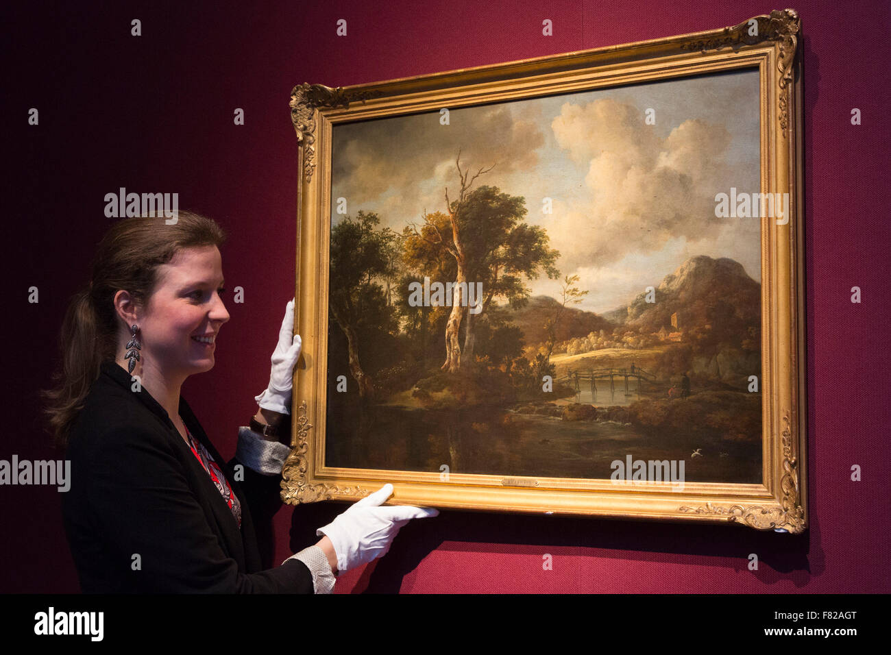 London, UK. 4 December 2015. Pictured: A Wooded River Landscape with Figures Crossing a Bridge by Jacob van Ruisdael, estimate: GBP 250,000-350,000. Christie's are re-examining nature, still life and Venice in the Old Master and British Paintings evening sale on 8 December 2015 in London. At this sale a large selection of paintings from private collections will be offered at auction, some of which have never been offered at auction before. Stock Photo
