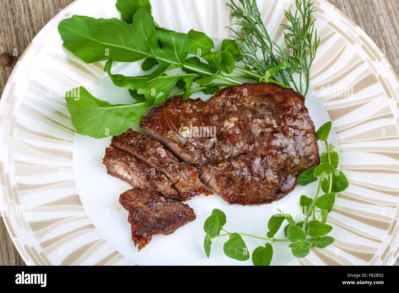 Roasted beef steak with dill, ruccola and spices Stock Photo Alamy