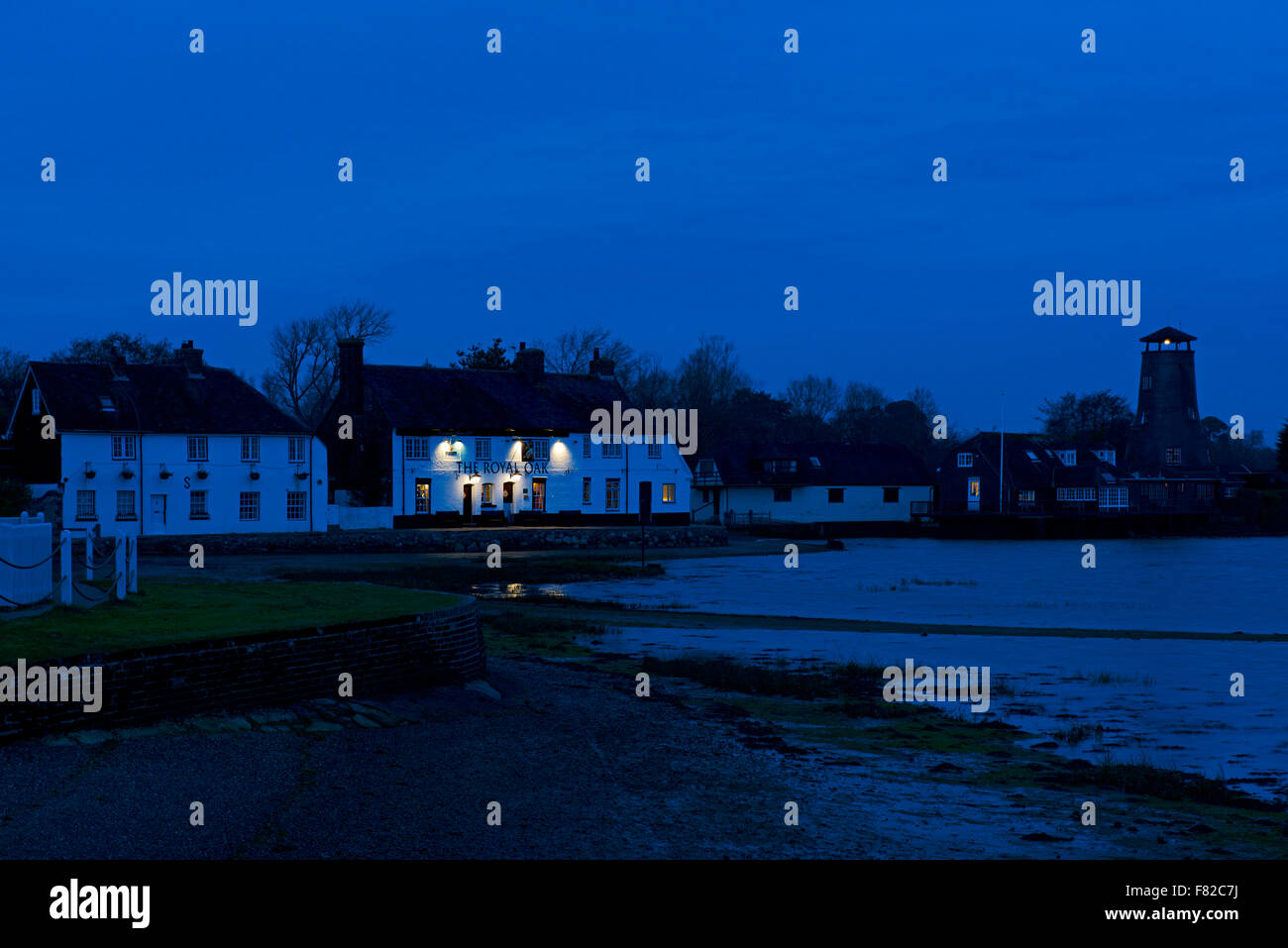 The Royal Oak pub and Langstone Mill, at night, Langstone, Havant, Hampshire, England UK Stock Photo