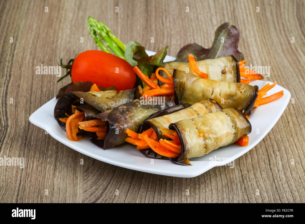 Eggplant rolls with carrot served spices and coriander Stock Photo Alamy