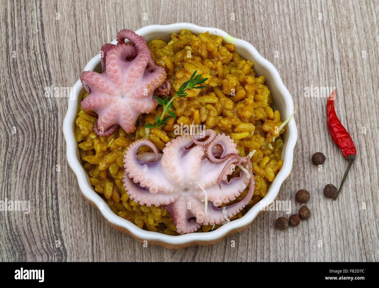 Seafood risotto with octopus, cheese and thyme leaf Stock Photo - Alamy