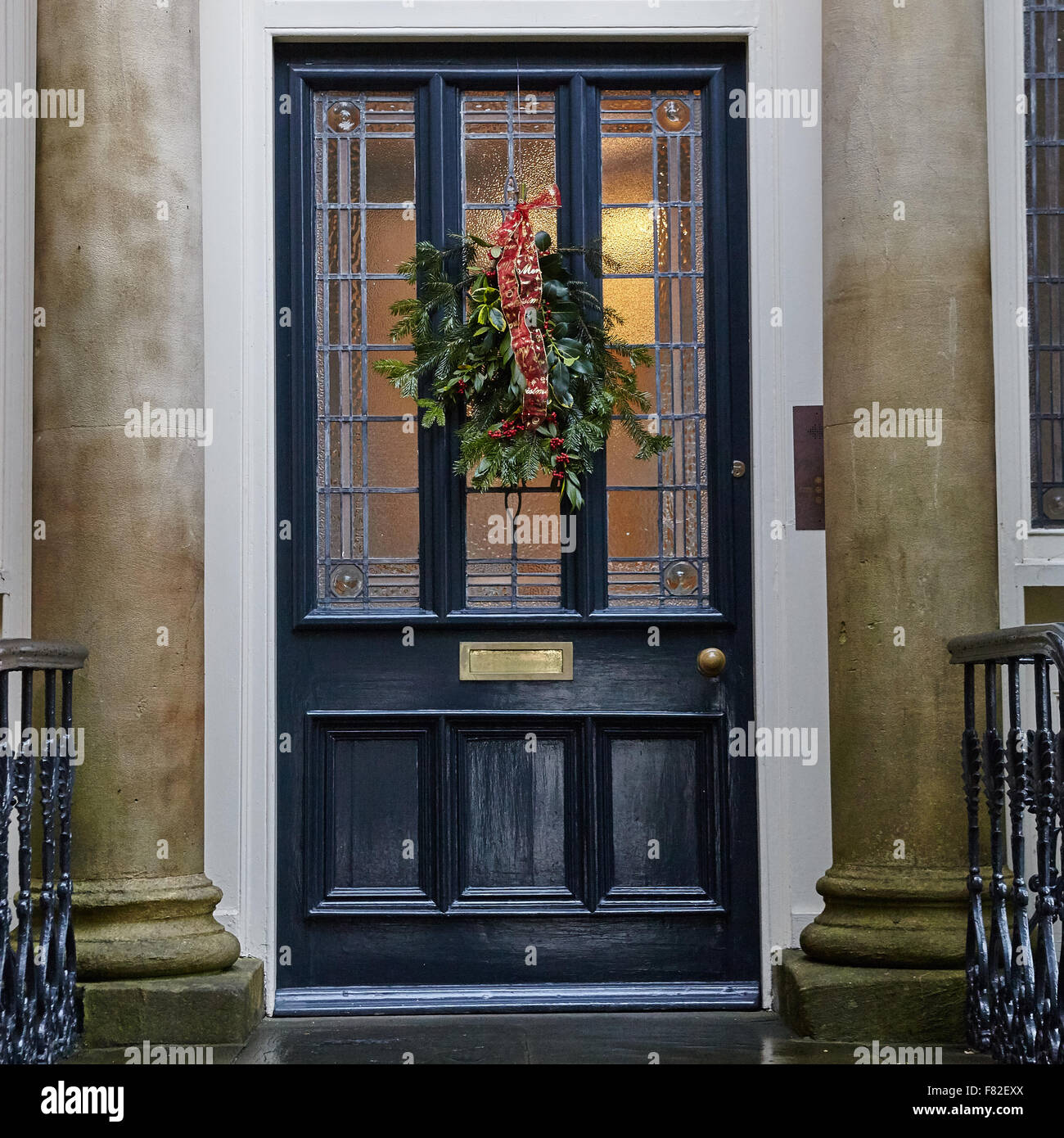 Evergreen Christmas Wreath on door Stock Photo