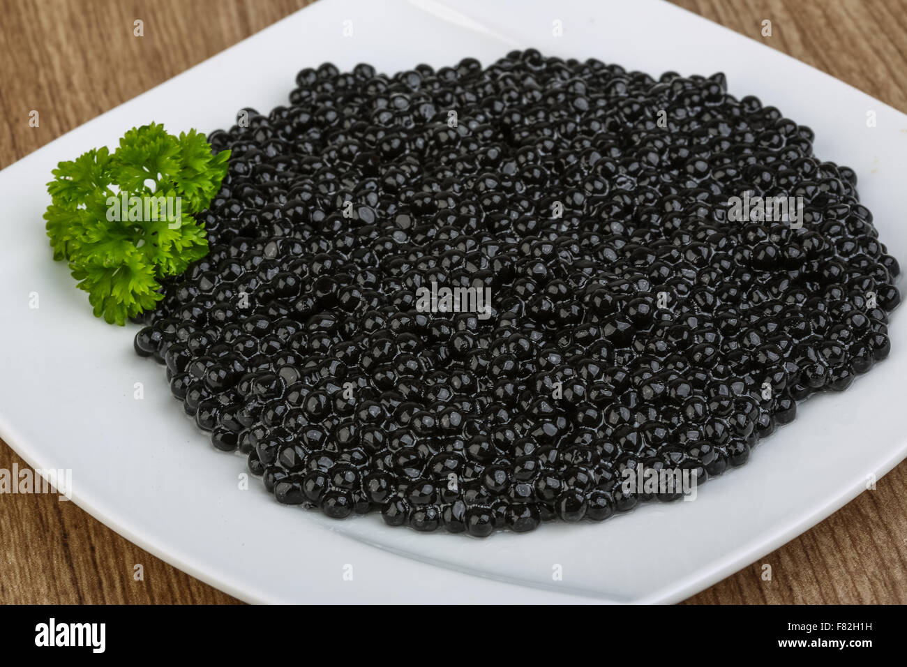 Luxury Black caviar in the bowl with parsley leaves Stock Photo Alamy