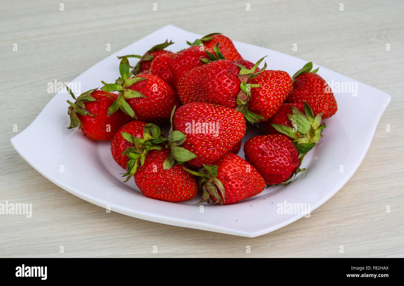 Fresh ripe Strawberries in the wooden background Stock Photo - Alamy