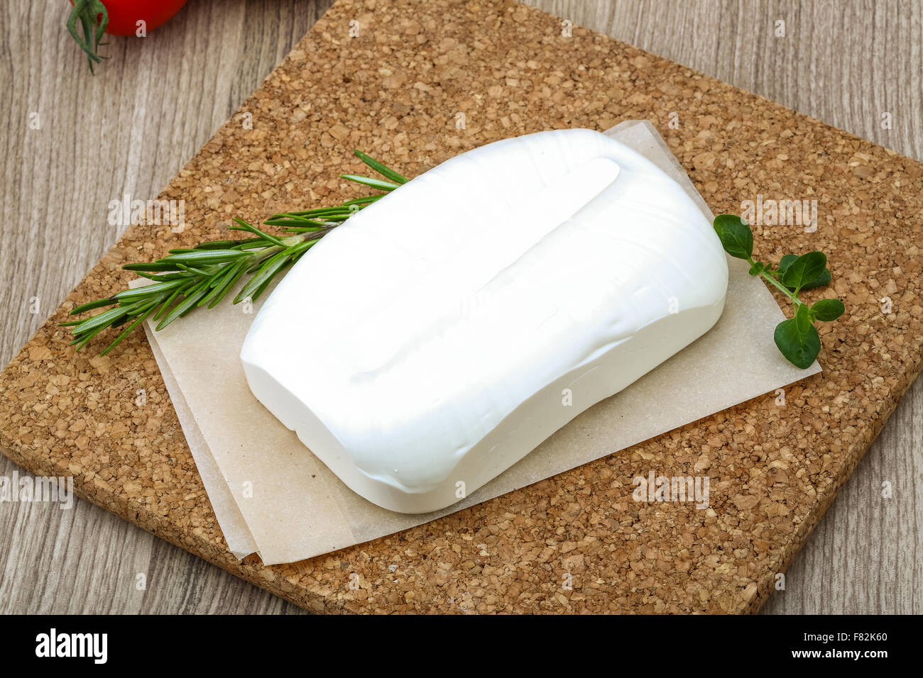 Traditional Greek cheese - Feta with herbs on the wood background Stock ...