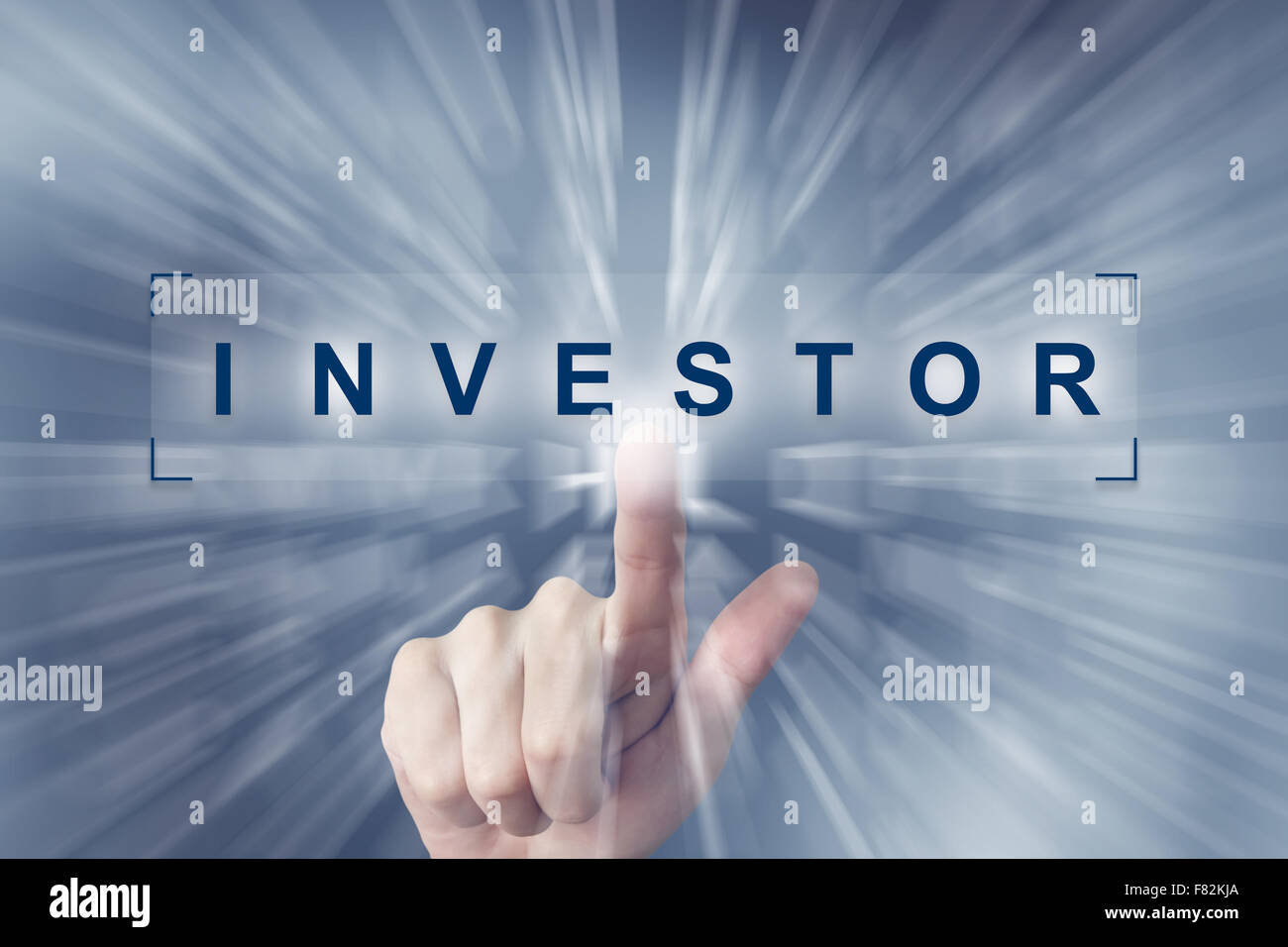 hand clicking on investor button with zoom effect background Stock Photo