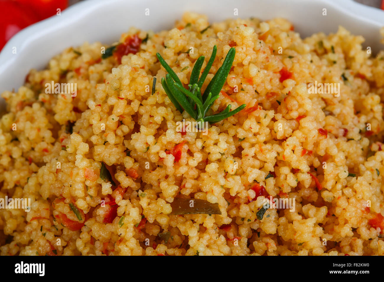 Arabic traditional cuisine Couscous with tomato and green onion Stock