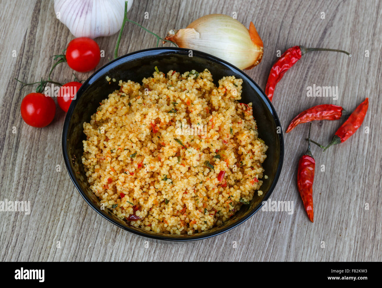 Arabic traditional cuisine Couscous with tomato and green onion Stock