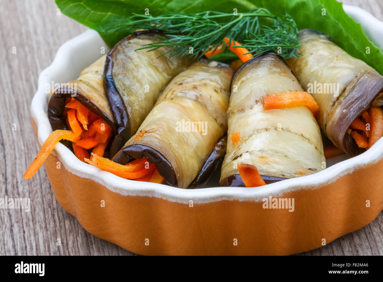Eggplant rolls with carrot served spices and coriander Stock Photo Alamy