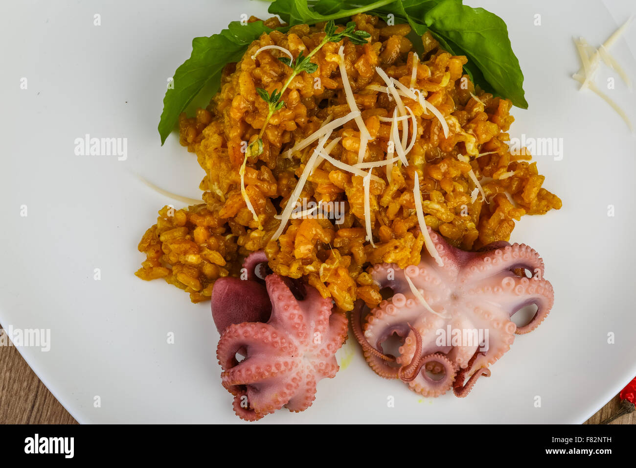 Seafood risotto with octopus, cheese and thyme leaf Stock Photo Alamy