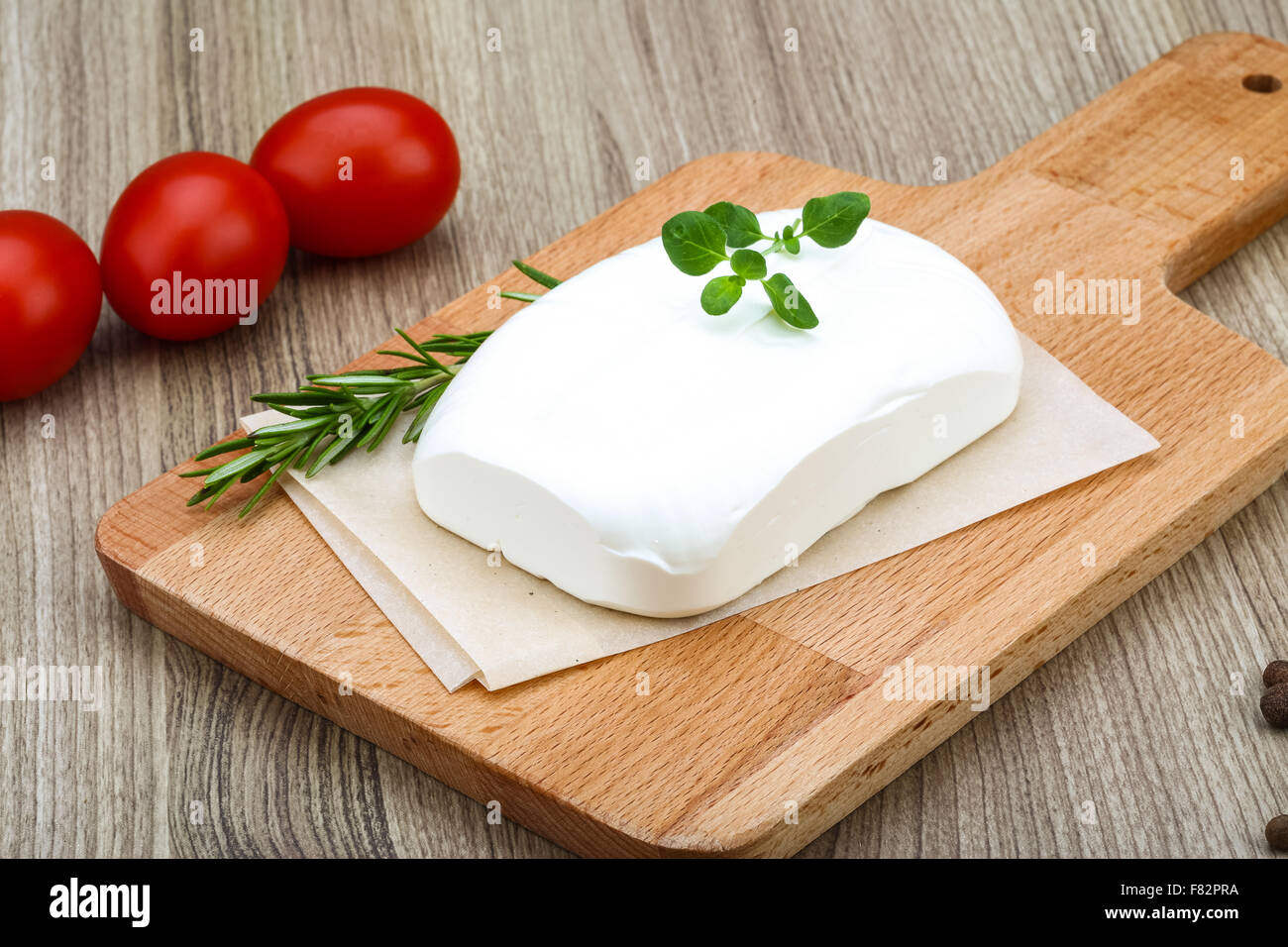 Traditional Greek cheese - Feta with herbs on the wood background Stock ...