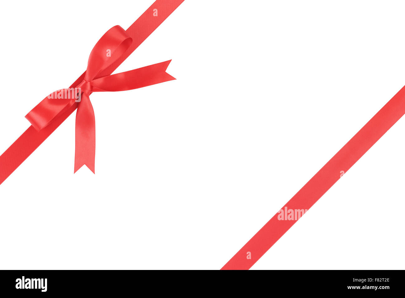 red ribbon with bow for packaging with tails isolated on white Stock Photo