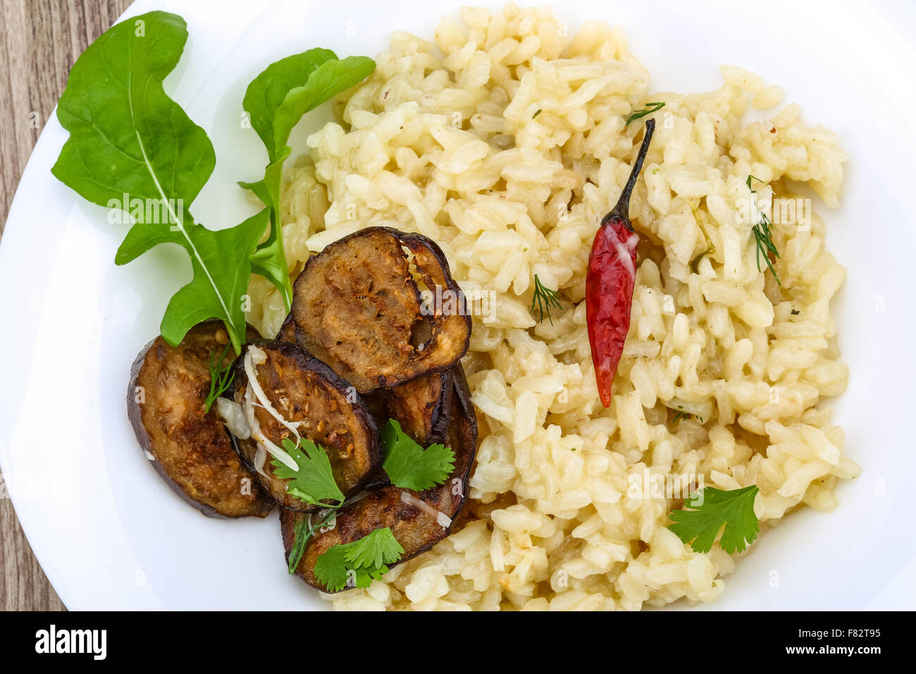 Italian trditional Risotto with eggplant and coriander Stock Photo Alamy