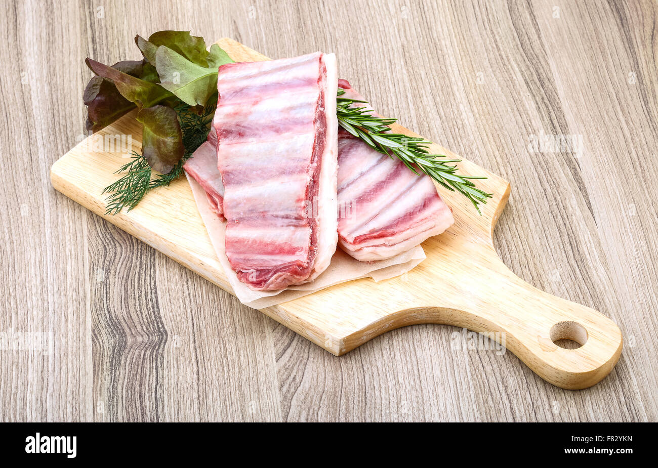 Fresh cold Raw lamb ribs with garlik and pepper - ready for cooking ...