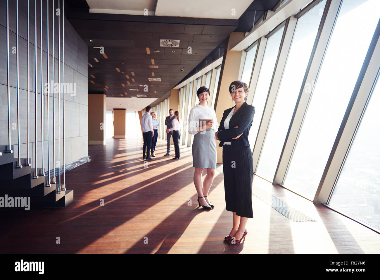 business people group, females as team leaders standing together in ...