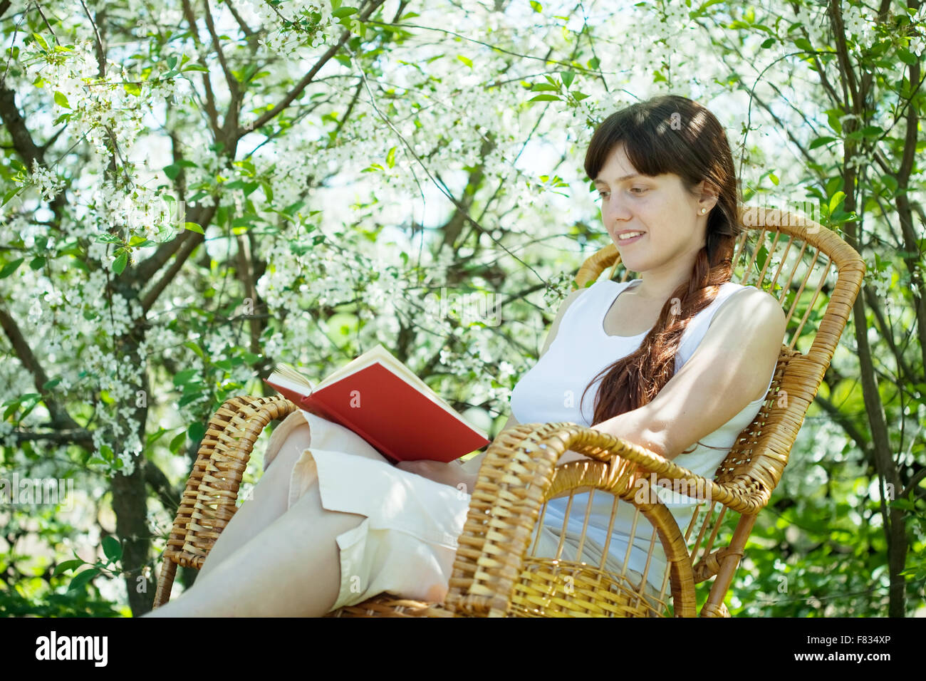 portrait of girl in spring blossoming garden Stock Photo - Alamy