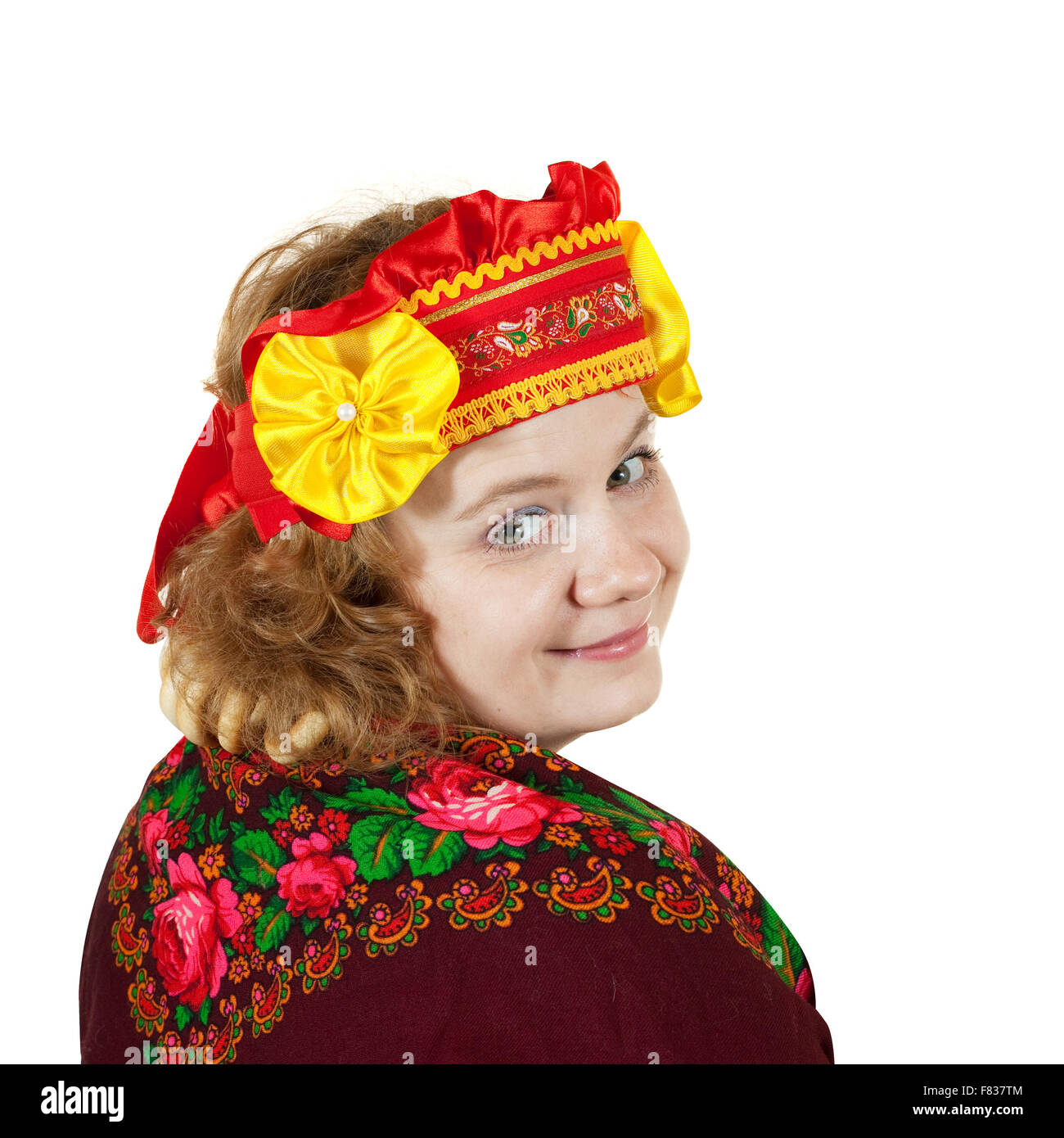 Studio shot of woman in russian traditional clothes isolated over