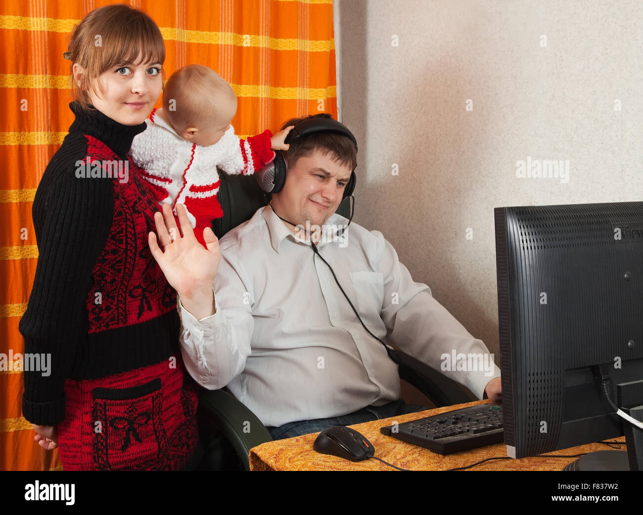 mother and daughter disturbs father work at home Stock Photo - Alamy