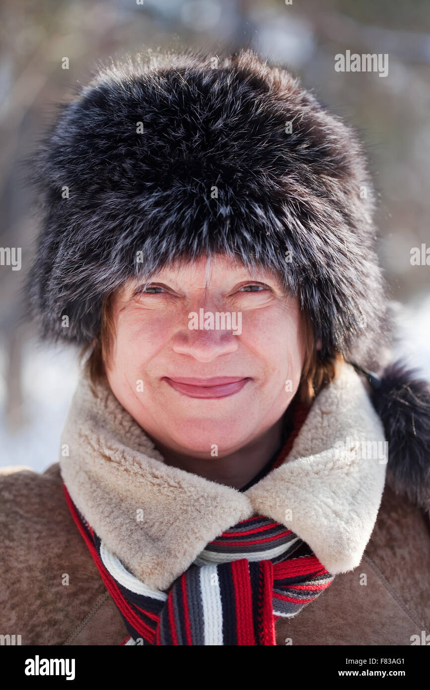 mature woman wearing winter coat and fur cap Stock Photo - Alamy