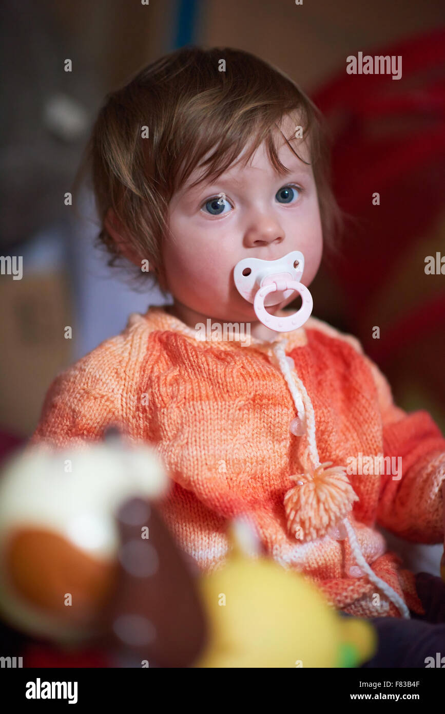 cute little child baby girl playing with toys at home Stock Photo - Alamy