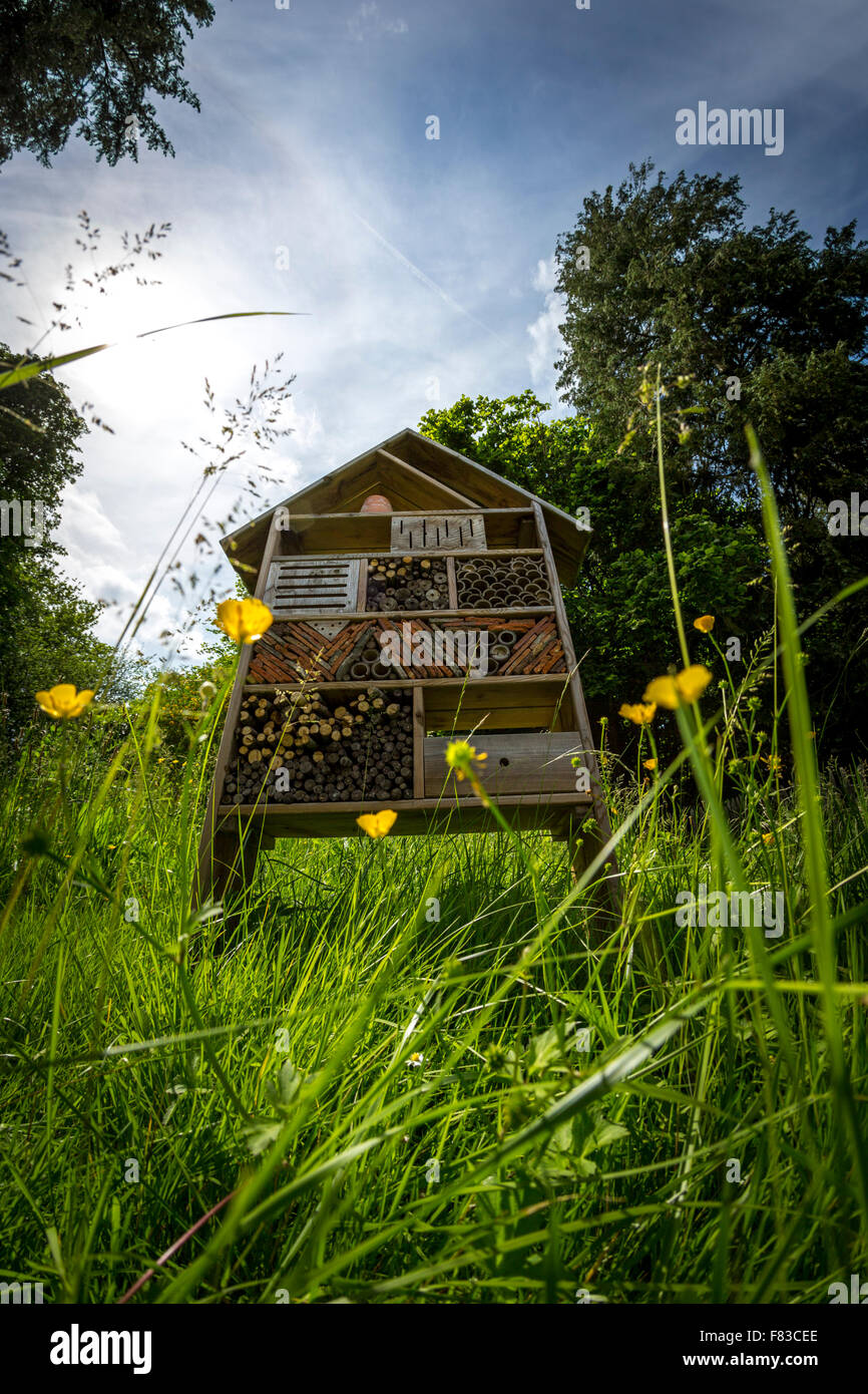 An insect hotel. This is a structure created with natural materials in order to provide many types of insects with a shelter. Stock Photo