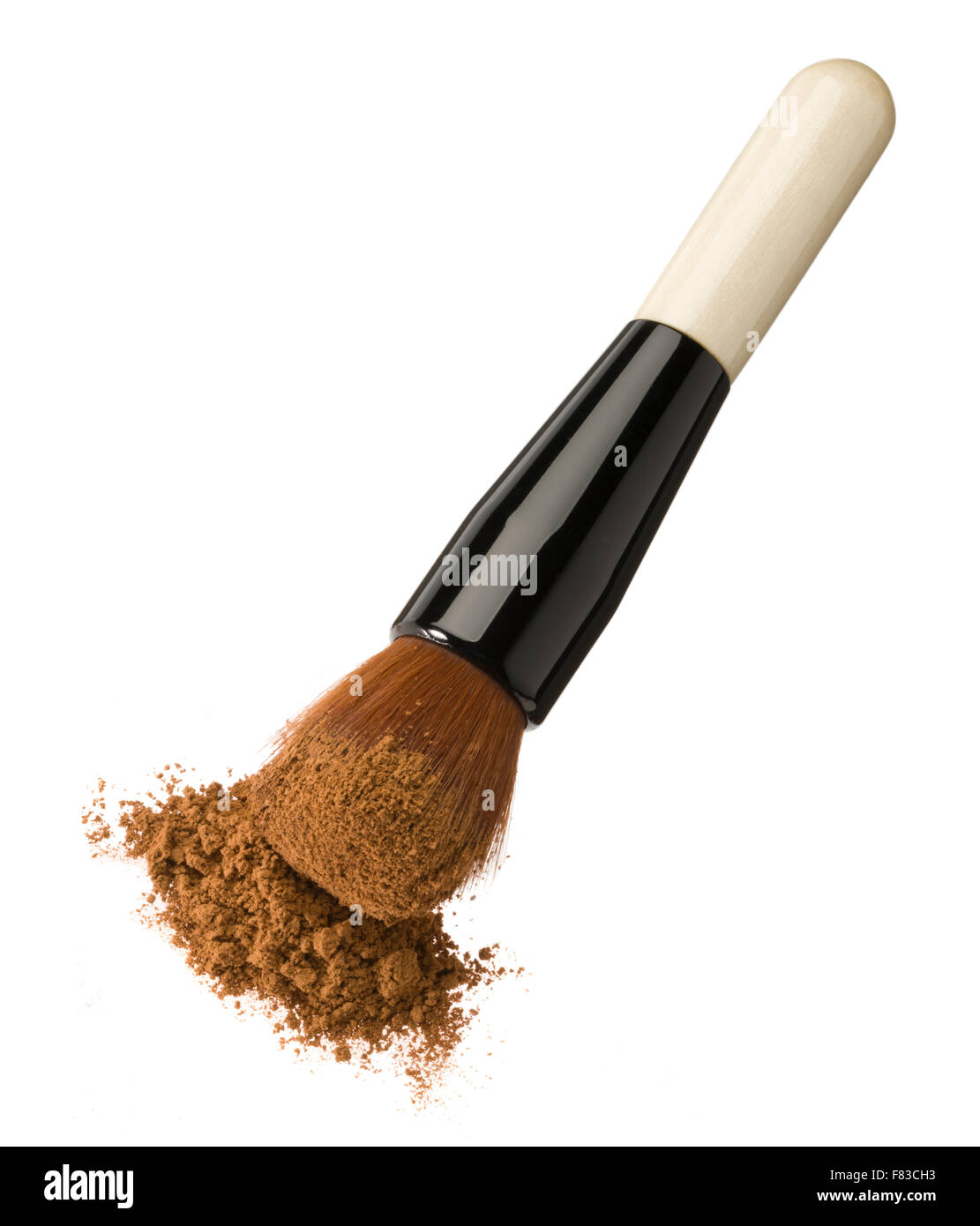 Foundation powder brush. Makeup applicator. Face paint. Apply foundation powder. Soft brush with warm skin colour makeup. Stock Photo