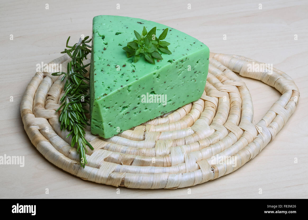 Green pesto cheese with rosemary basil leaves Stock Photo Alamy